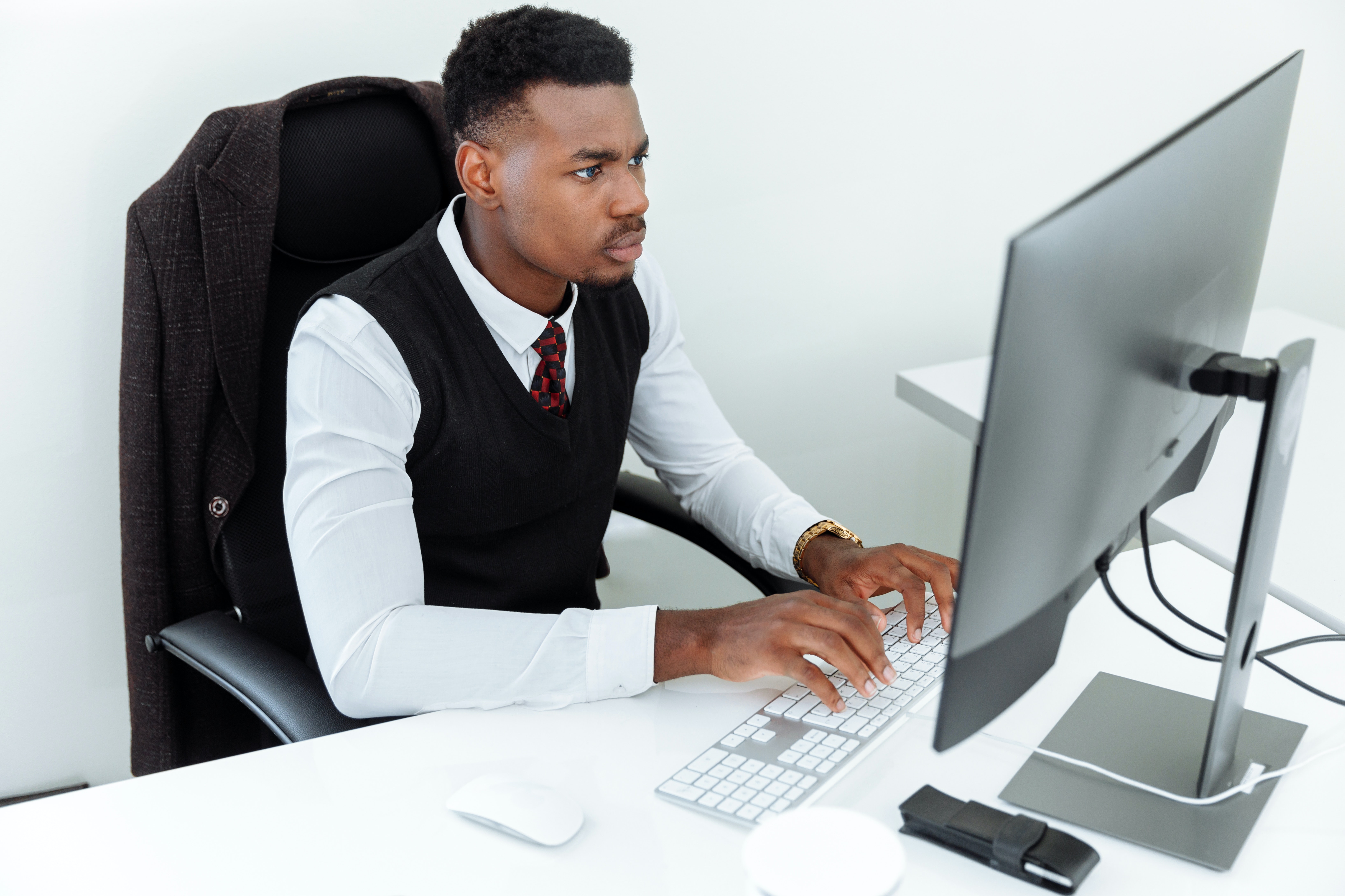 Close up of man on computer checking business credit services